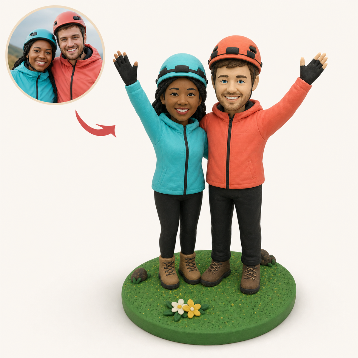 A couple in their walking gear, sculpted as a pair