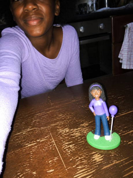 A customer holding their Clayfie clay mini